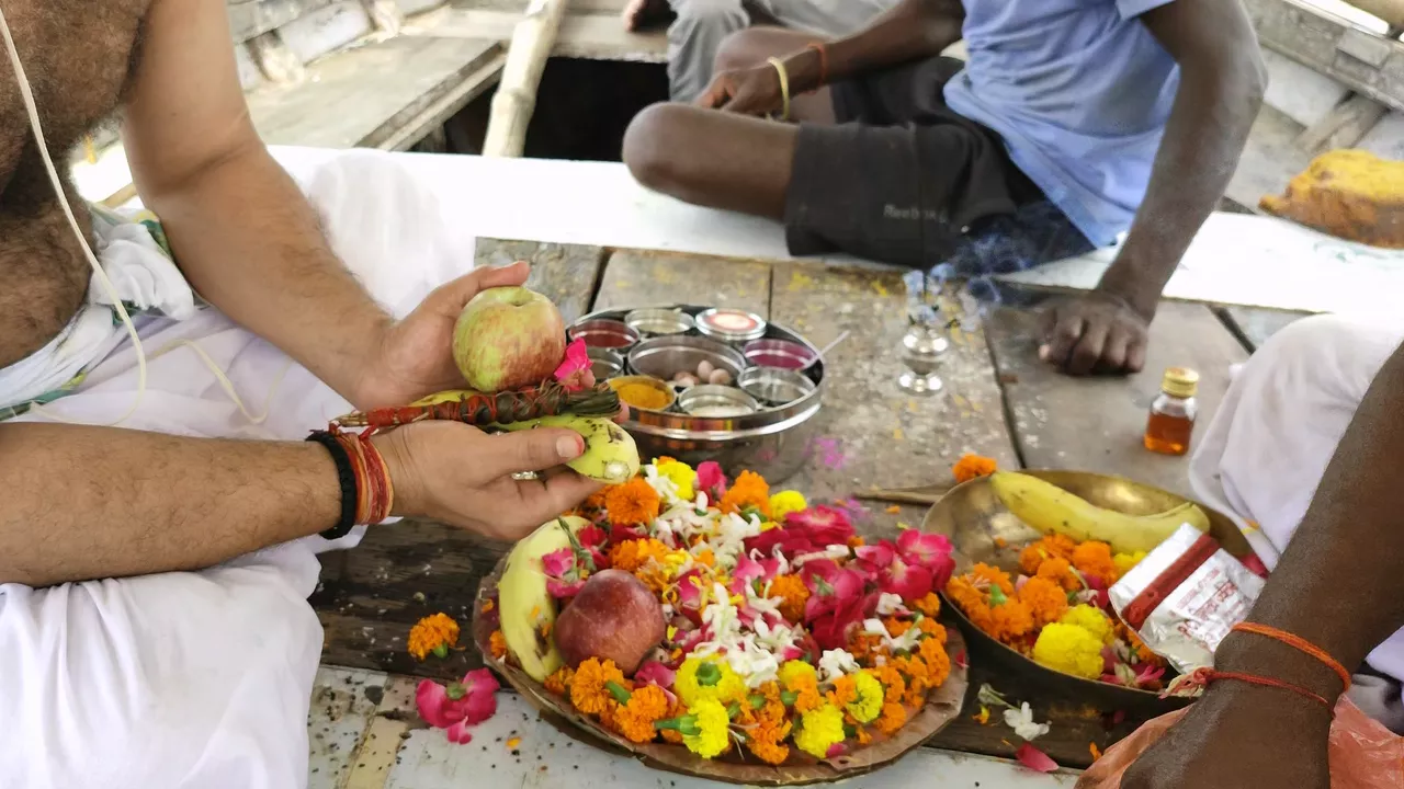Image of a person offering to their ancestors 