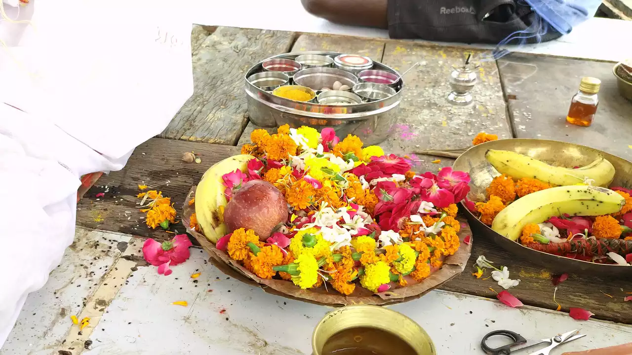 Offerings of fruits, flowers, incense, and water prepared for Shraddha ceremony-Benefits of performing Shradh
